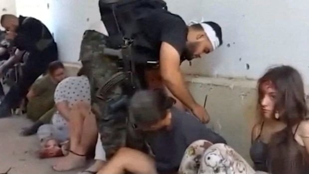 Families release footage of 5 female Israeli army conscripts taken hostage by Hamas on Oct. 7