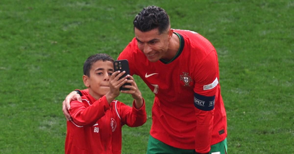 Cristiano Ronaldo poses for selfie with Euro 2024 pitch invader during Portugal vs Turkey | Football