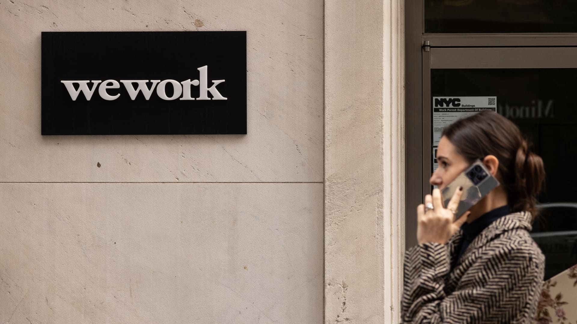 WeWork emerges from bankruptcy, announces John Santora as new CEO