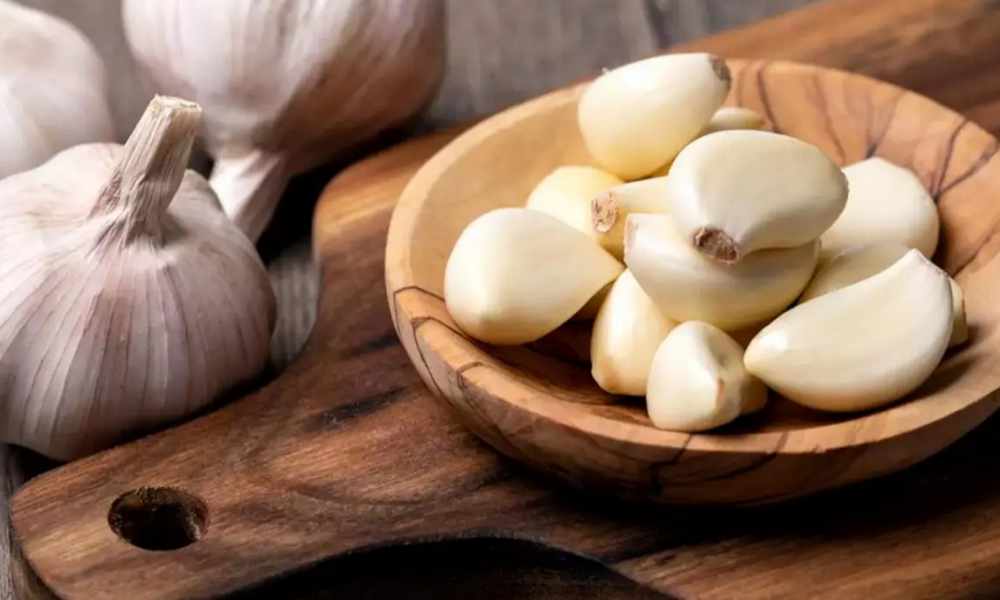 Does taking garlic have any effect on people suffering from hypertension?