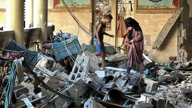 Gaza officials report dozens killed in Israeli strike on school complex. IDF says it was targeting militants