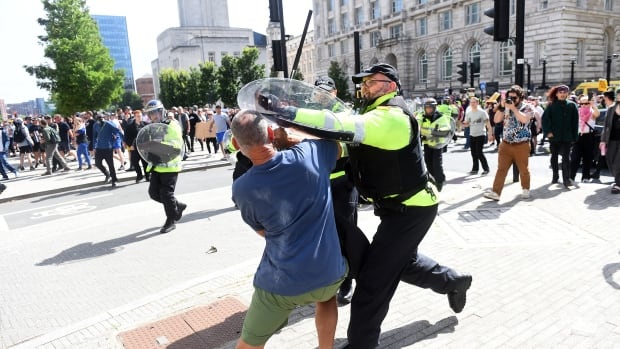 Far-right protesters clash with anti-racism groups, police across U.K.