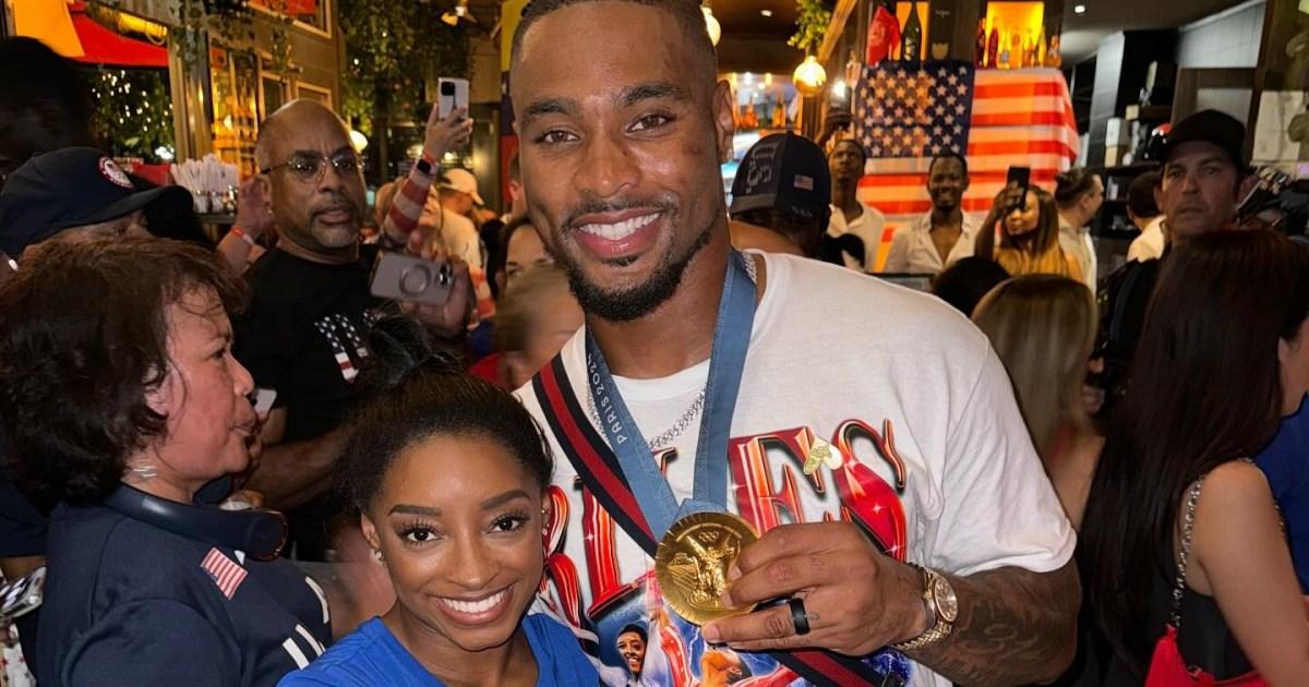 Simone Biles defends husband after he wears her Olympic gold medal