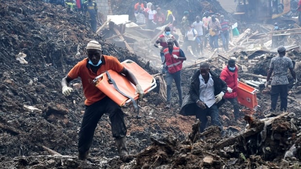 Vast garbage dump collapses onto homes in Uganda, search for victims continues