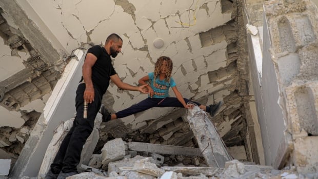 This 11-year-old does gymnastics atop the rubble of Gaza as the war rages on