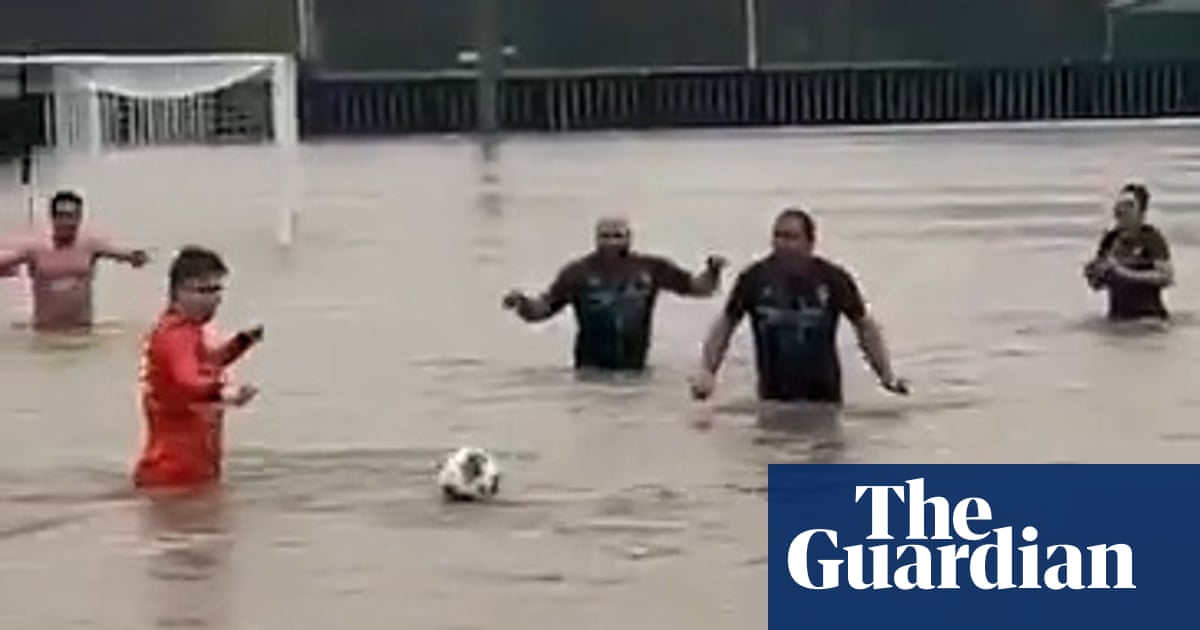 Football team take to pitch despite floodwaters during Storm Bert – video | Soccer