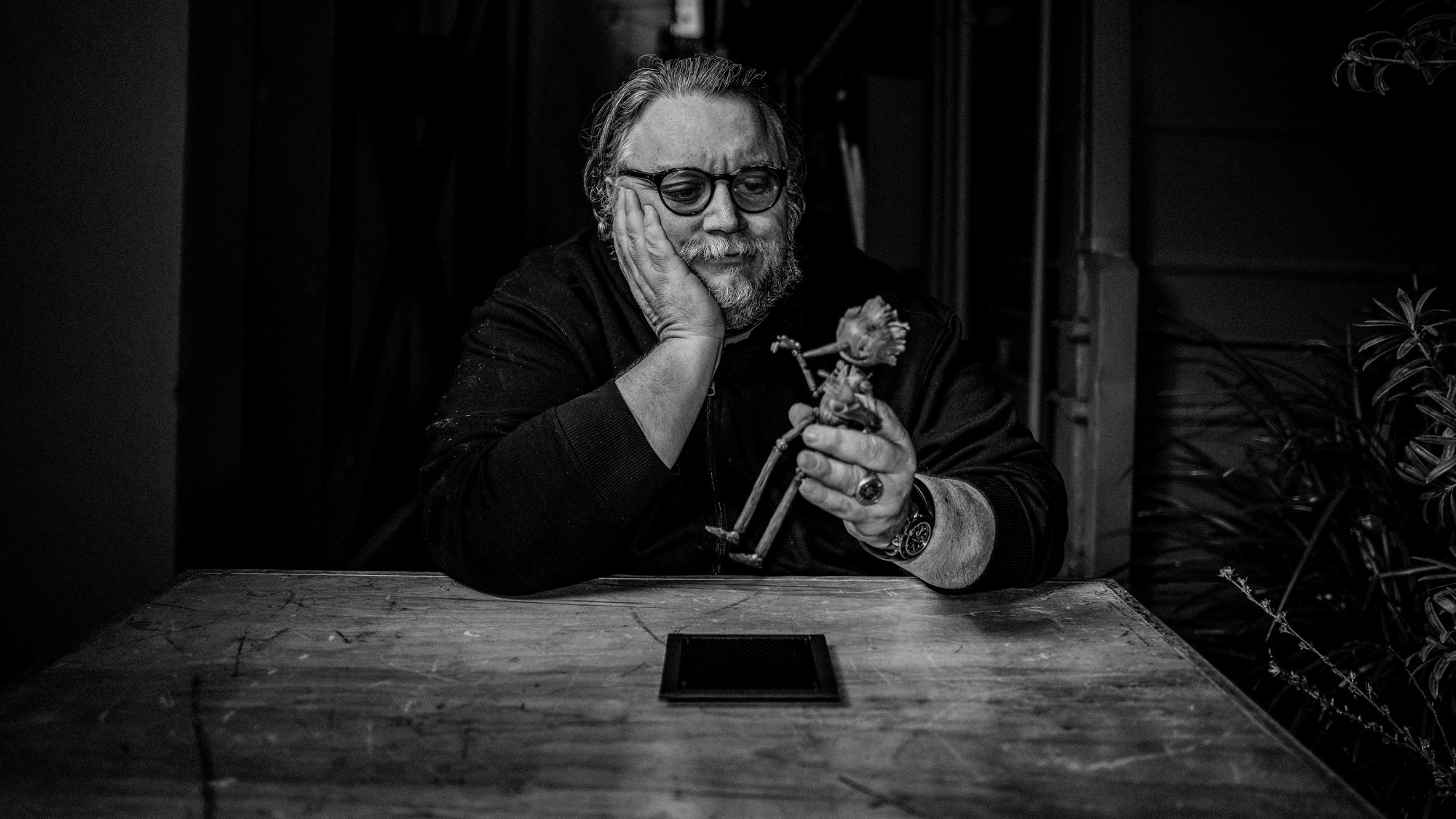 Guillermo del Toro holding Pinocchio doll