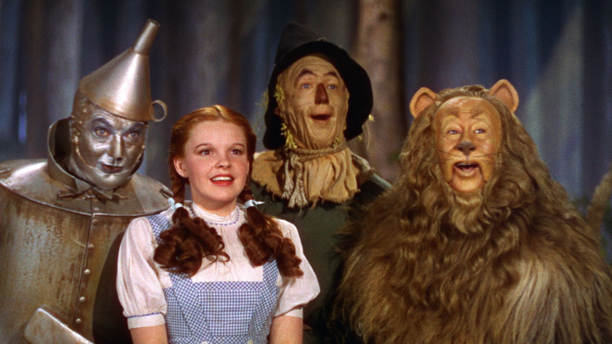 Judy Garland as Dorothy, Ray Bolger as Scarecrow, Bert Lahr as Cowardly Lion, and Jack Haley as Tin Man in 1939