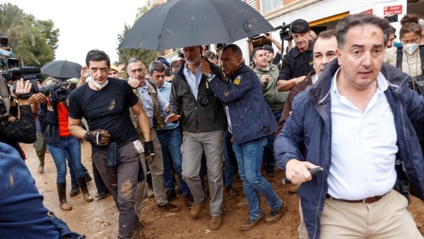 ‘Get out,’ Spain’s king and queen told by protesters flinging mud at them after devastating flood