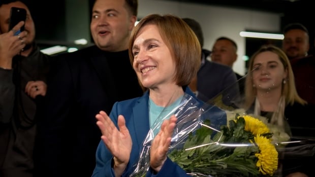 Moldova re-elects pro-West president in vote marred by Russian meddling claims, bomb threats