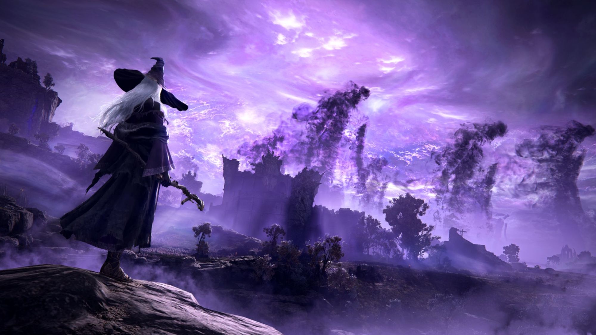 A Wizard looks at giant shadow figures in the horizon in Elden Ring: Nightreign