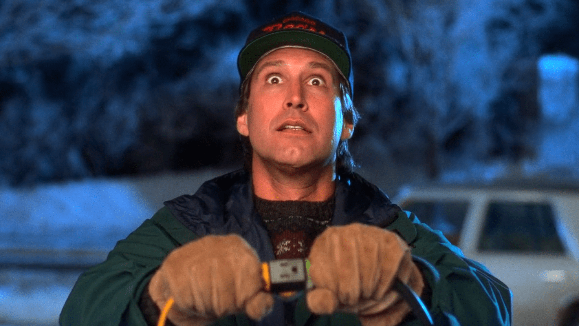 Chevy Chase as Clark Griswold in Christmas Vacation holding light switch