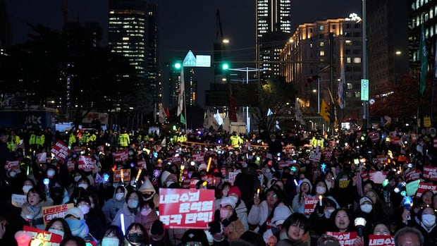 South Korean police reportedly raid president's office over martial law declaration