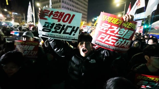 Opposition party demands South Korea's president step down after imposing martial law